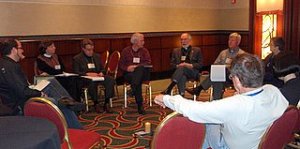 A group of  participants are taking part in a seminar on the topic of the Emerging Church led by Dr. Dwight Friesan (who is on the left side of the picture).